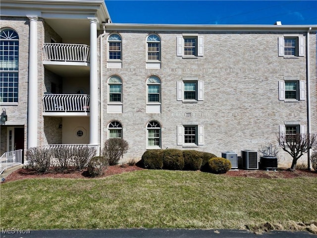 view of building exterior with central AC unit