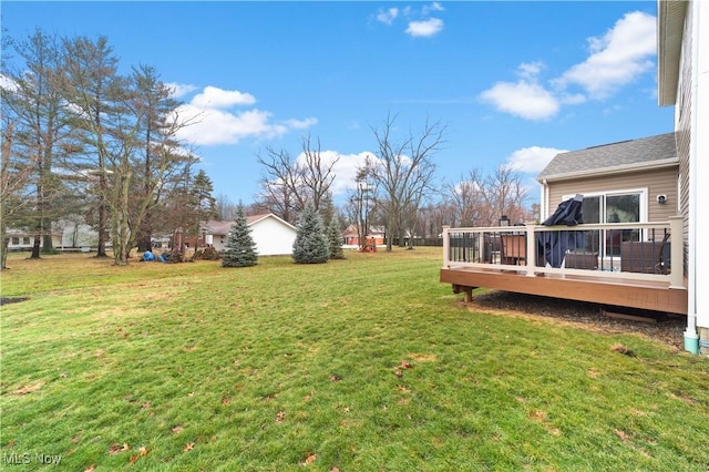 view of yard featuring a wooden deck