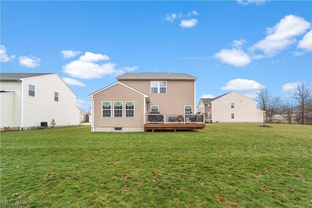 rear view of house featuring a deck, central AC, and a yard