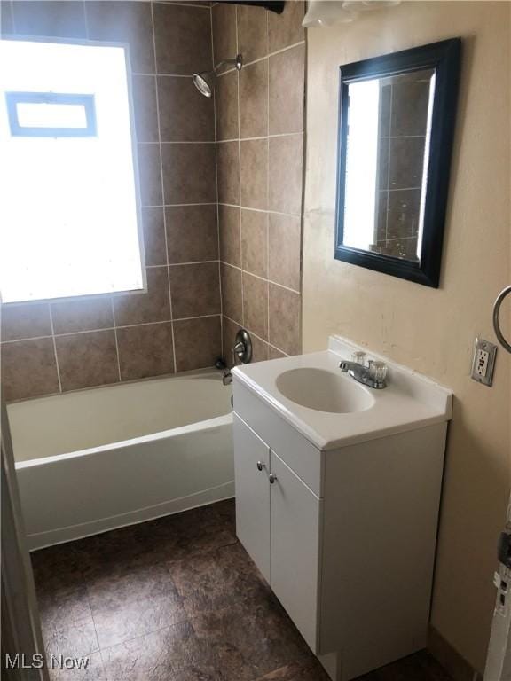 bathroom featuring shower / washtub combination and vanity