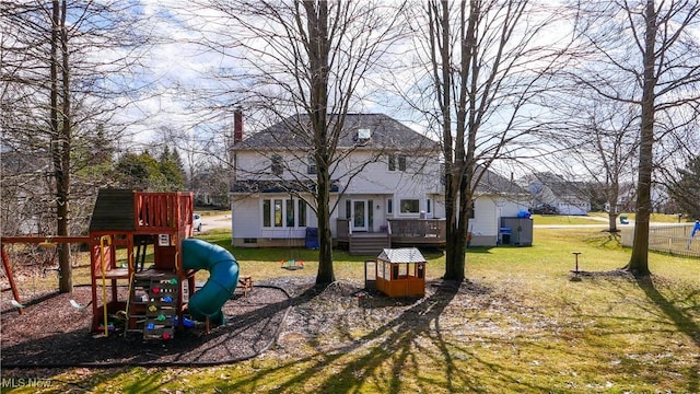 view of yard featuring a playground and a wooden deck