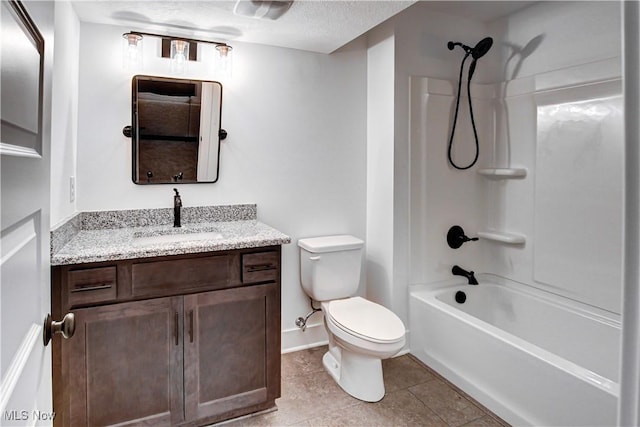 bathroom with bathtub / shower combination, toilet, vanity, tile patterned flooring, and baseboards