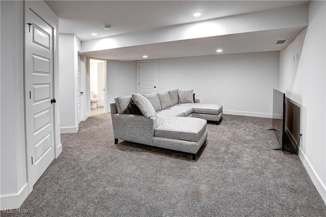 carpeted living area featuring recessed lighting, visible vents, and baseboards