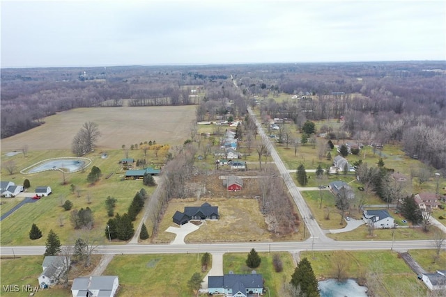 birds eye view of property featuring a rural view