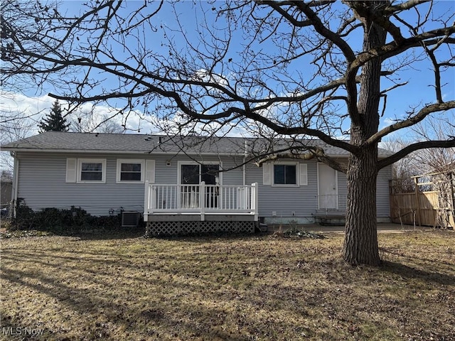 view of front facade featuring a deck and cooling unit