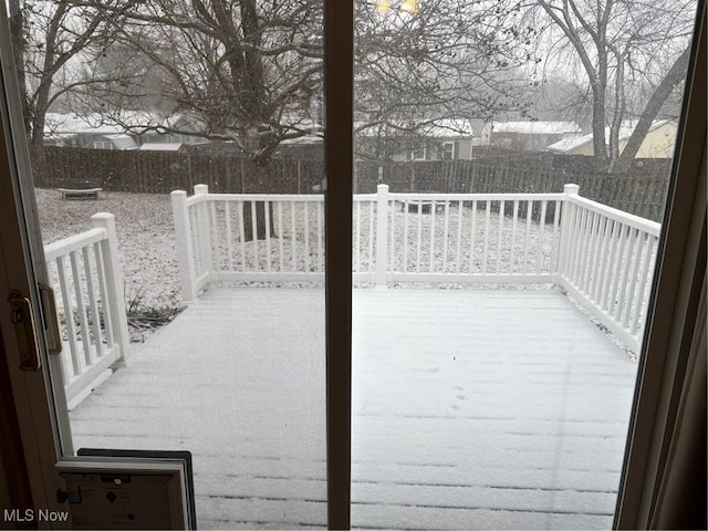 wooden deck with a fenced backyard