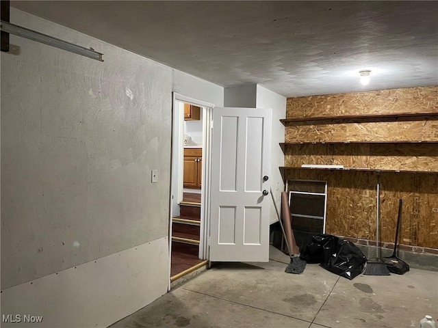 interior space with unfinished concrete floors