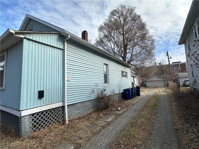 view of property exterior with a chimney