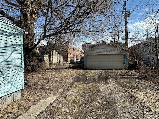 exterior space featuring an outbuilding and a detached garage