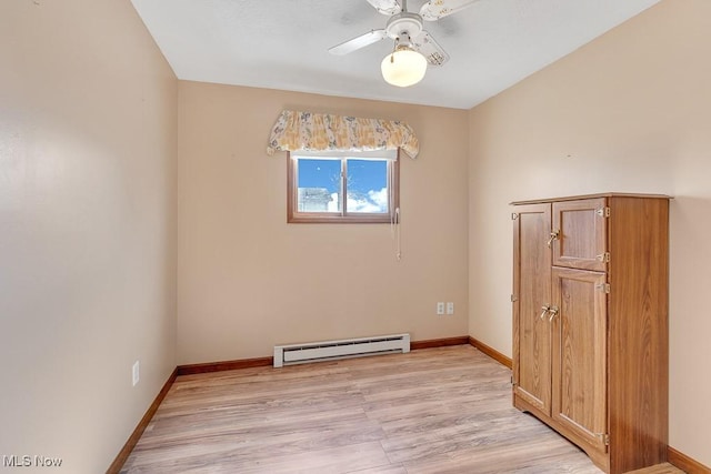 empty room with a baseboard radiator, baseboards, ceiling fan, and light wood finished floors