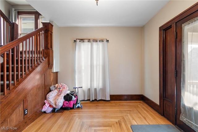 interior space featuring baseboards