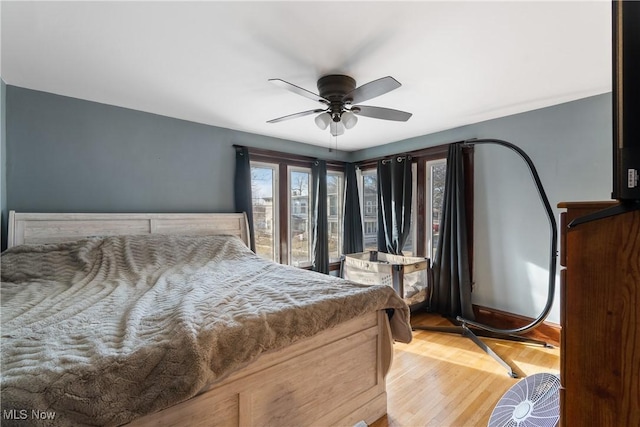 bedroom featuring a ceiling fan and wood finished floors