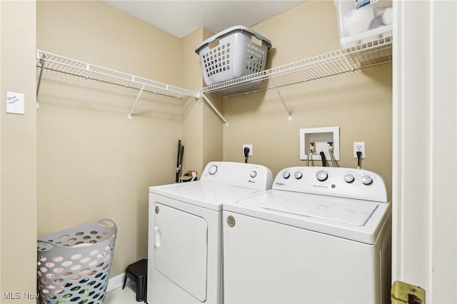 laundry room featuring laundry area and washer and clothes dryer