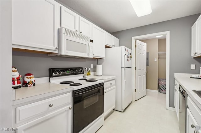 kitchen with white cabinets, white appliances, baseboards, and light countertops