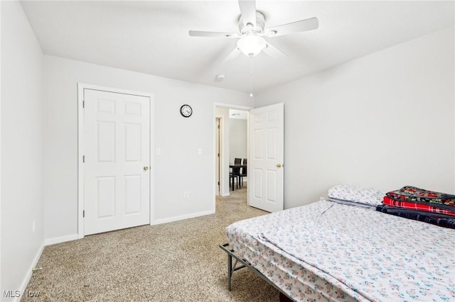 bedroom with carpet floors, ceiling fan, and baseboards