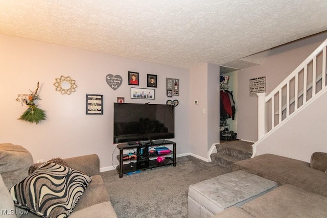 living room featuring baseboards, carpet, stairway, and a textured ceiling