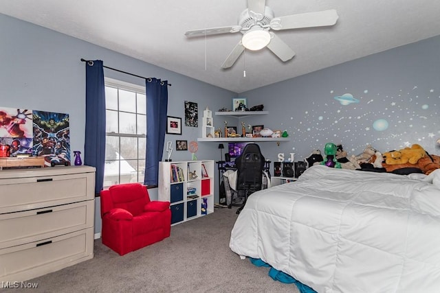 bedroom featuring a ceiling fan and carpet