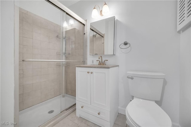 bathroom with a stall shower, marble finish floor, vanity, and toilet