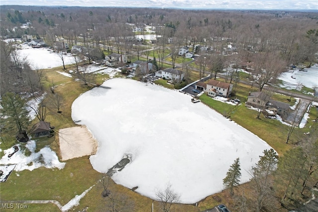 bird's eye view featuring a forest view and a residential view