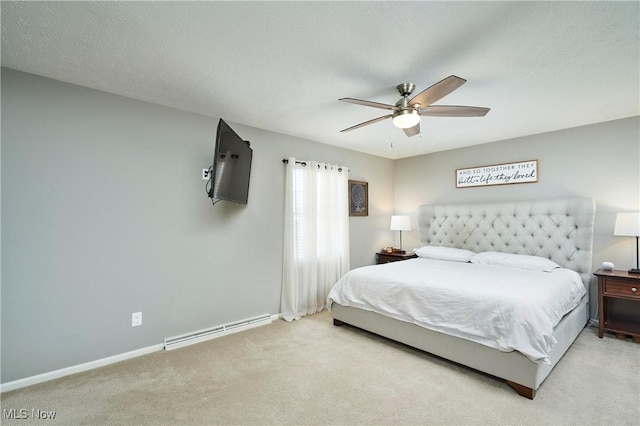 bedroom featuring baseboards, ceiling fan, a textured ceiling, carpet flooring, and a baseboard heating unit