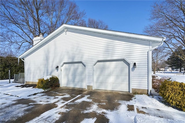 view of snow covered garage