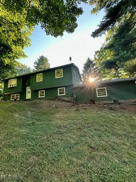 rear view of house with a lawn