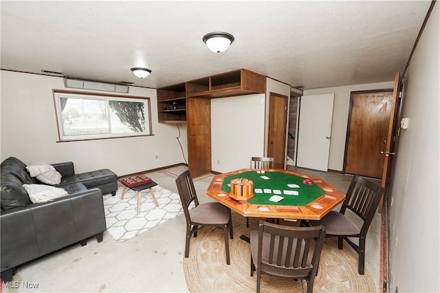 playroom with concrete flooring and visible vents