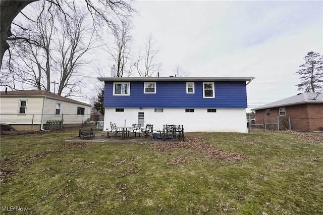 back of property featuring a patio area, a fenced backyard, and a yard