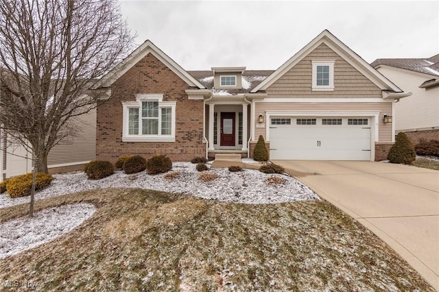 view of front of property with driveway and brick siding