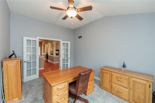 office area with lofted ceiling, ceiling fan, light colored carpet, visible vents, and french doors