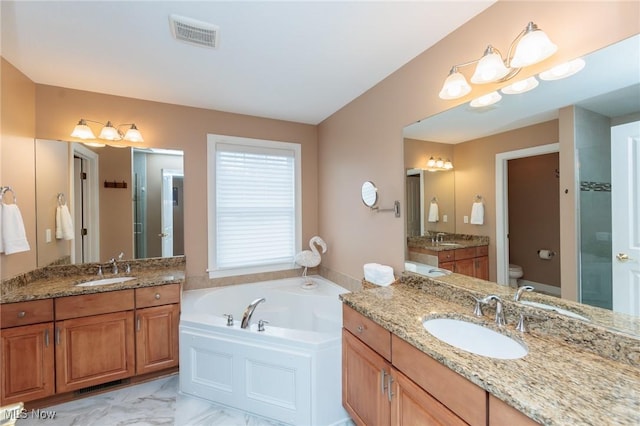 full bathroom with visible vents, a sink, and toilet