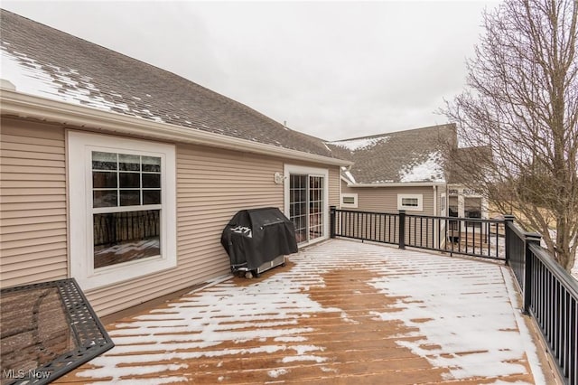 snow covered deck featuring grilling area