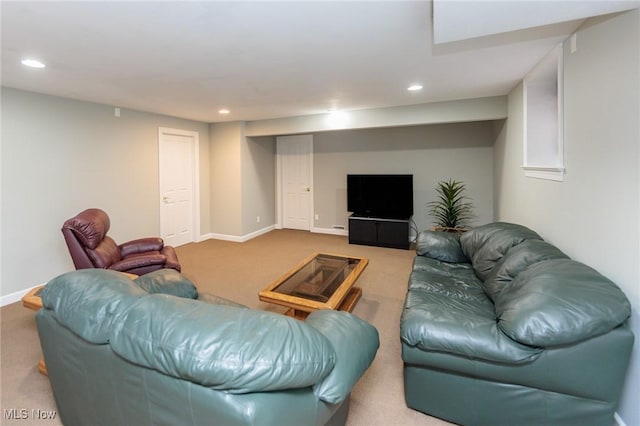 carpeted living room featuring baseboards and recessed lighting