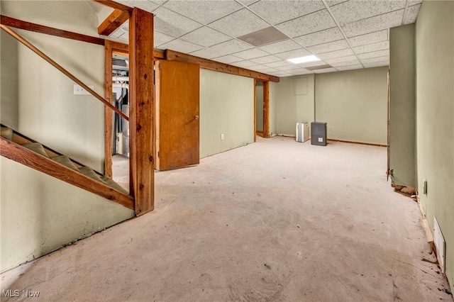 finished basement with a drop ceiling