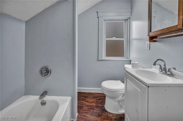 full bath featuring shower / bathtub combination, toilet, wood finished floors, vanity, and vaulted ceiling