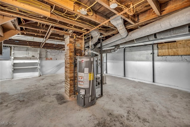 unfinished basement featuring gas water heater