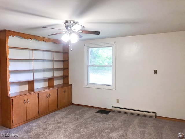 empty room with ceiling fan, light colored carpet, a baseboard heating unit, visible vents, and baseboards