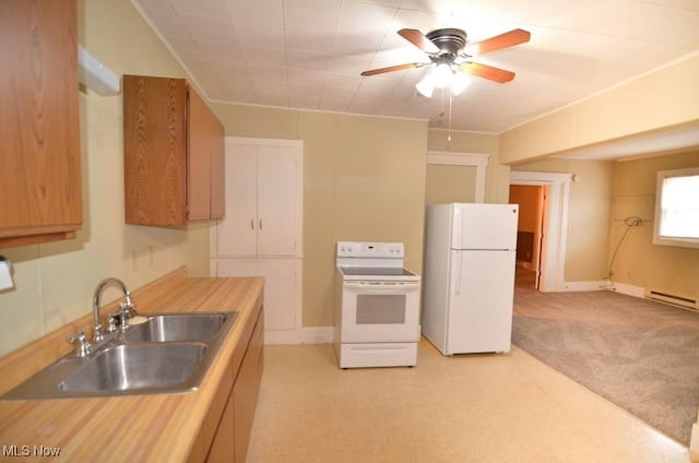 kitchen with a baseboard radiator, light countertops, a ceiling fan, a sink, and white appliances