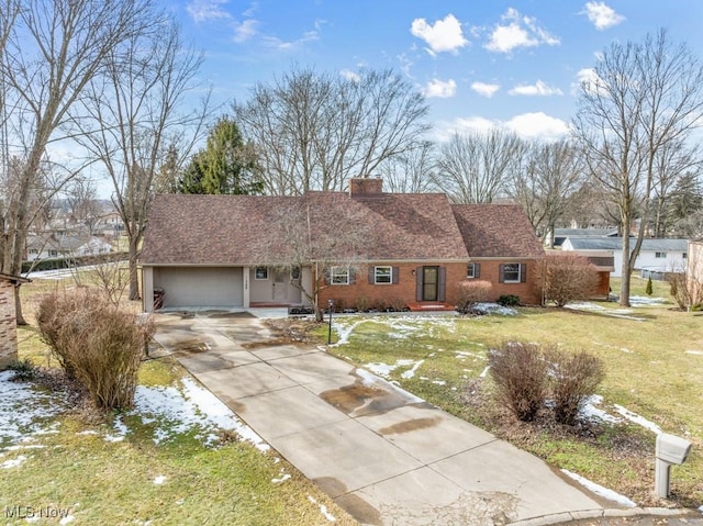 ranch-style house featuring brick siding, a chimney, concrete driveway, and a front yard