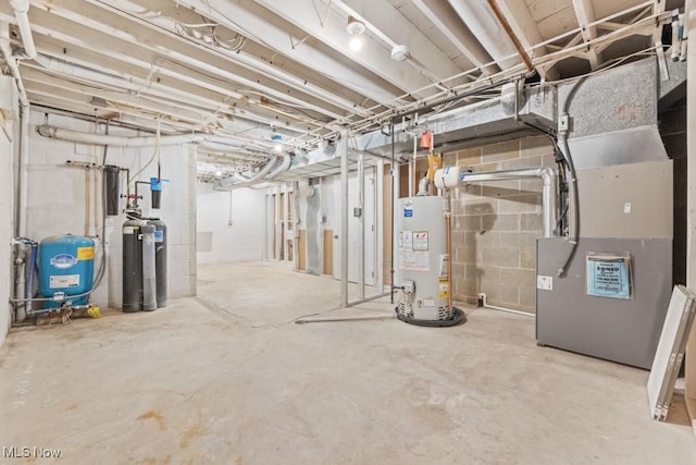 unfinished basement with heating unit and water heater