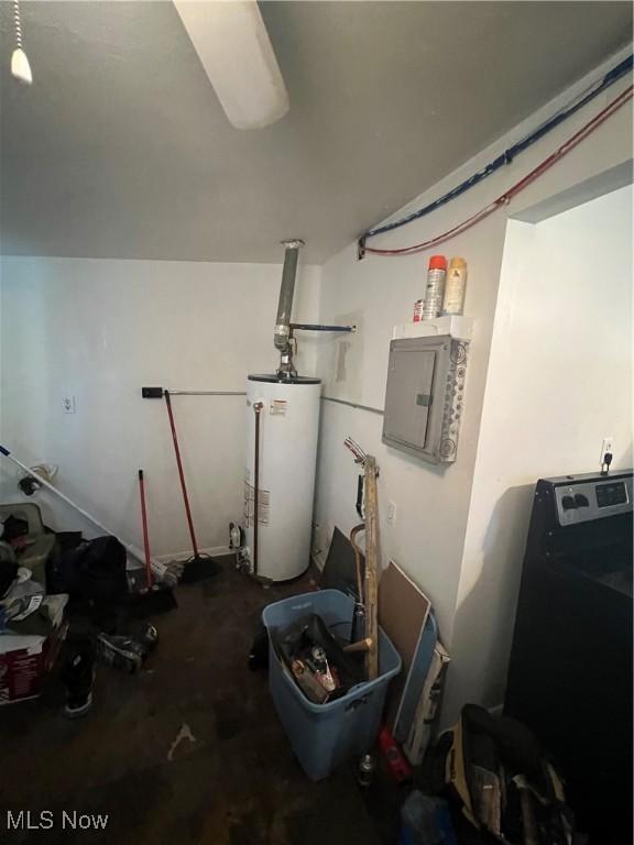 garage featuring water heater, washer / clothes dryer, and electric panel