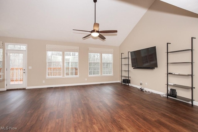 unfurnished living room featuring dark wood finished floors, a ceiling fan, lofted ceiling, and baseboards