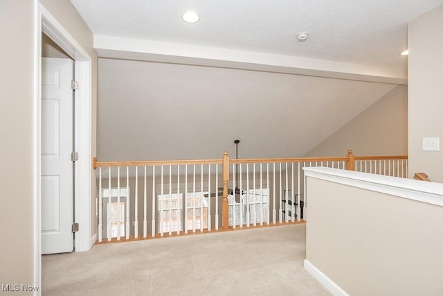 hallway featuring lofted ceiling with beams, recessed lighting, and carpet floors