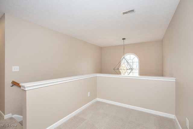 interior space with baseboards and visible vents