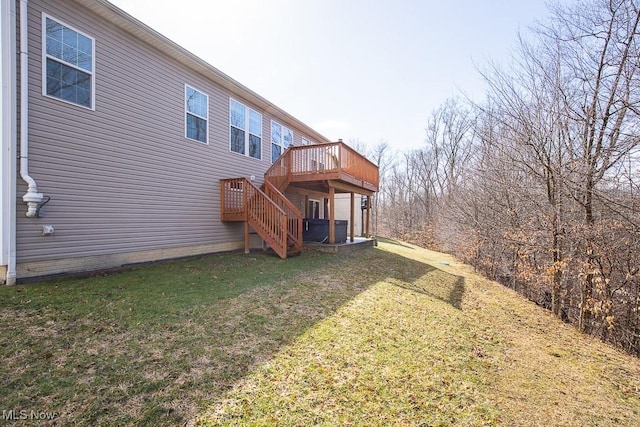 back of property with stairway, a lawn, and a wooden deck