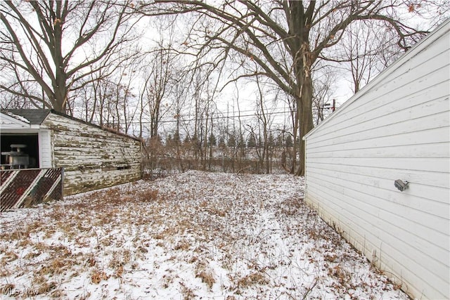 view of yard covered in snow