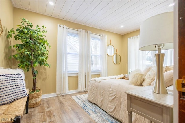 bedroom with baseboards, wood ceiling, wood finished floors, vaulted ceiling, and recessed lighting