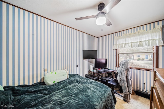 bedroom featuring wallpapered walls, ceiling fan, and carpet flooring