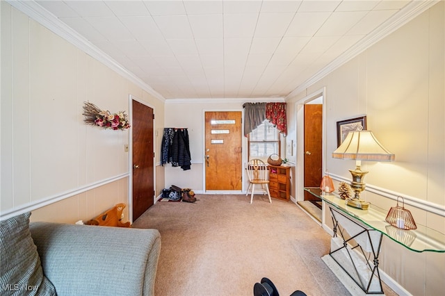 interior space with ornamental molding and carpet flooring