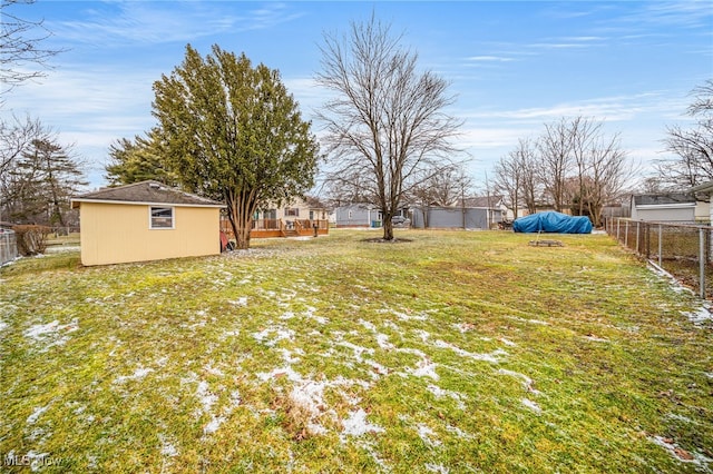 view of yard with an outbuilding and fence